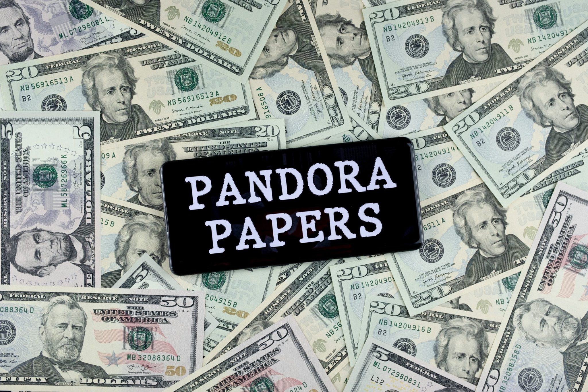 Pandora Papers on a pile of money