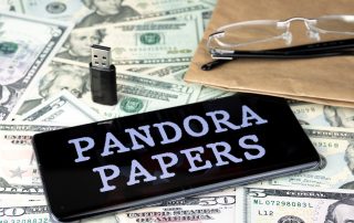 Pandora Papers on pile of money