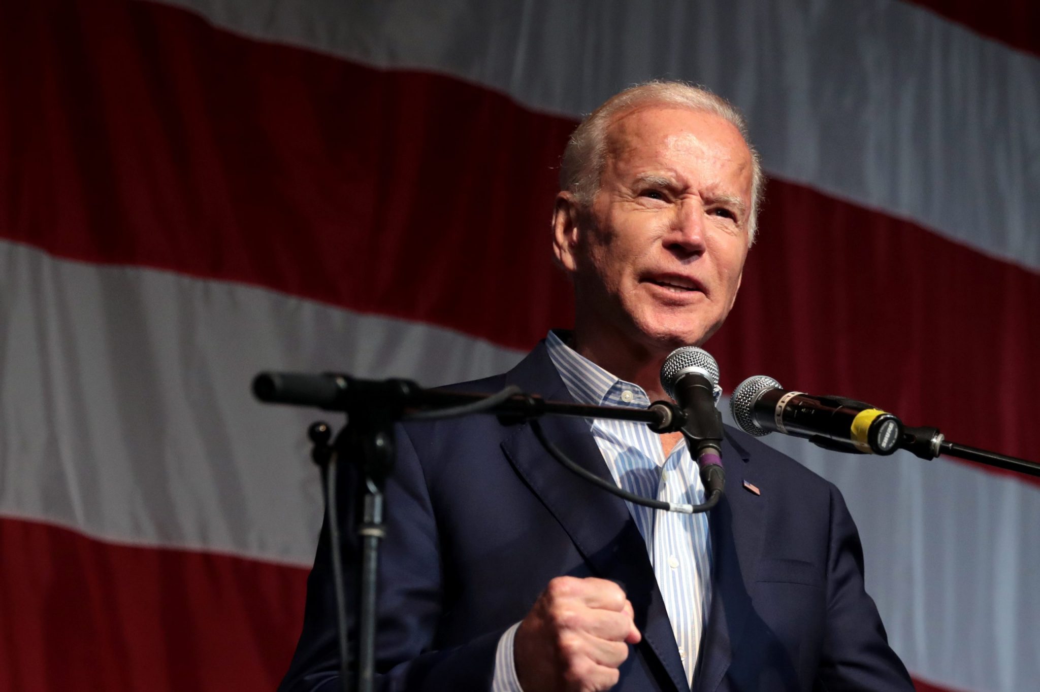 Biden speaking in front of American flag
