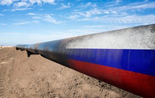 Gas pipeline with Russian flag. Concept of natural gas distribution through pipes with Russian flag on it.