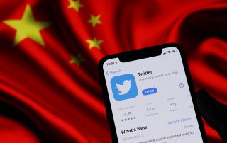 Twitter application on phone screen and China flag background