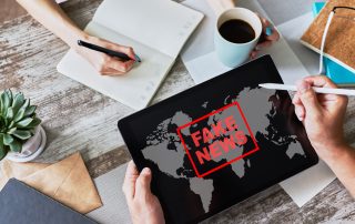 Fake news sign on screen. Propaganda and disinformation. Media and internet concept.