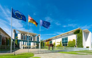 The German Chancellery in Berlin with flags of the European Union, Germany and the G7, August 3, 2022