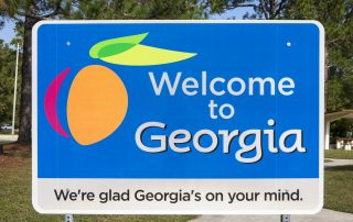 KINGSLAND, GEORGIA/USA - Welcome to Georgia sign. The state was established in 1733, the last of the original Thirteen Colonies and is known as The Peach State.