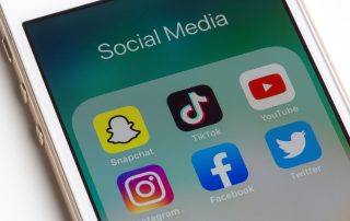 Portland, OR, USA - Nov 5, 2019: Snapchat, TikTok, Youtube, Instagram, Facebook, and Twitter mobile app icons are seen on an iPhone.