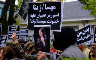 Protestors take part during a demonstration in front of the Iranian embassy in Brussels, Belgium on Sept. 23, 2022, following the death of Mahsa Amini.