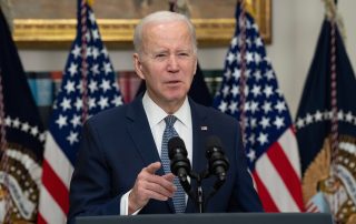 Washington, DC US - Mar 13, 2023: US President Joe Biden speaking in front of American flag