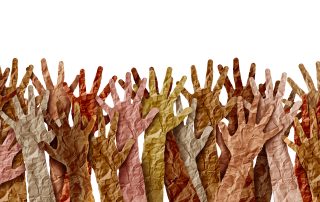 Diverse multicultural hands raised