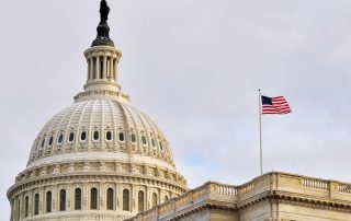 US capitol building with US flag