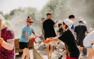 06.08.2022 Irpin, Ukraine: a group of volunteers is sorting through the rubble of a house destroyed by Russian missiles.