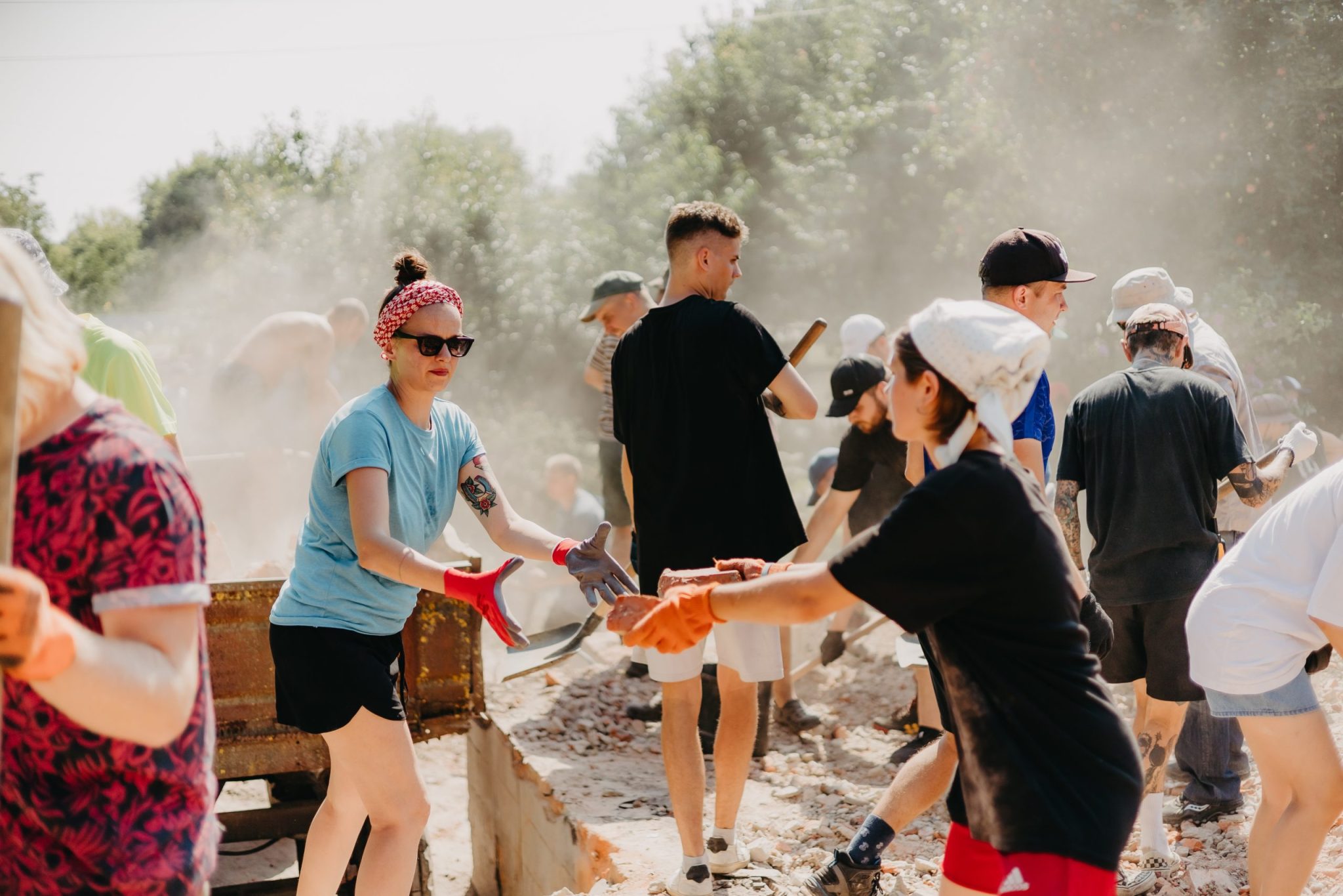 06.08.2022 Irpin, Ukraine: a group of volunteers is sorting through the rubble of a house destroyed by Russian missiles.